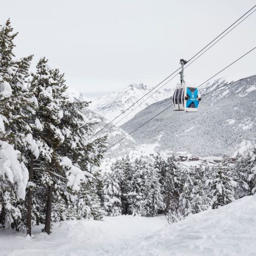 Snowy scene in Grandvalira showing a gondola ski lift